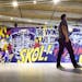 Minneapolis-based artist Greg Gossell used a lively pop-art style in his 25-yard-long mural “The Vikings Are Coming” in a concourse of the new U.S