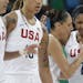 Maya Moore, right, and Diana Taurasi (patting Moore) led the U.S. with 19 points each Tuesday. The Americans advanced to the semifinals.