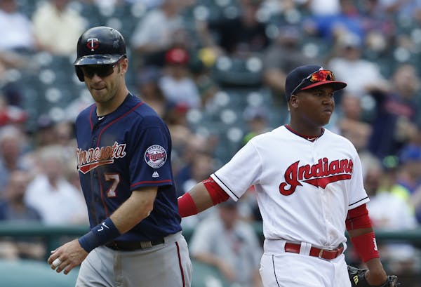 The Indians’ Jose Ramirez tagged out the Twins’ Joe Mauer between second and third base during the fifth inning. He was forced to try to advance, 