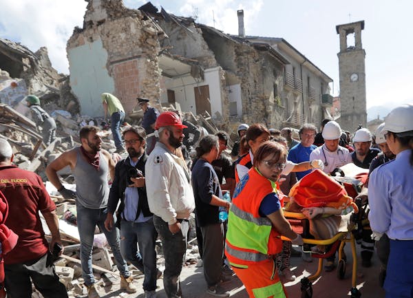 A victim is pulled out of the rubble following an earthquake in Amatrice Italy, Wednesday, Aug. 24, 2016. The magnitude 6 quake struck at 3:36 a.m. (0