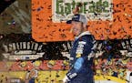 Martin Truex Jr. celebrates in Victory Lane after winning the NASCAR Sprint Cup Series auto race at Darlington Raceway on Sunday, Sept. 4, 2016, in Da