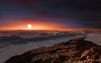 This artist rendering provided by the European Southern Observatory shows a view of the surface of the planet Proxima b orbiting the red dwarf star Pr