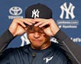 New York Yankees designated hitter Alex Rodriguez struggles putting on his cap before announcing that Friday, Aug. 12, 2016, will be his last game as 