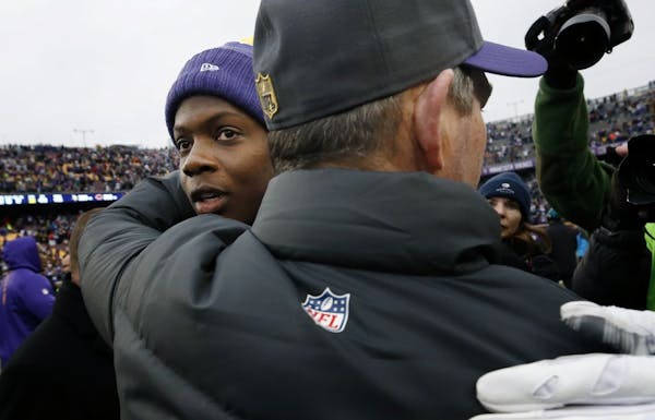 Vikings quarterback Teddy Bridgewater (5) hugged head coach Mike Zimmer at the end of the game.