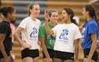 Returning Eagan players (from left) Kennedi Orr, Ellie Husemann and co-captains McKenna Melville, Brie Orr and Alyssa Doucette had a few laughs before