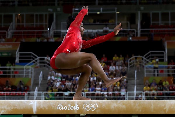 U.S. gymnast Simone Biles loses her balance during the women's balance beam competition on Monday, Aug 15, 2016, costing her a chance at a gold medal.