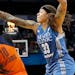 Connecticut's Courtney Williams was defended by Lynx guard Seimone Augustus in the second quarter Sunday at Target Center.