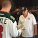 The Wild's Charlie Coyle delivers season tickets on Thursday.