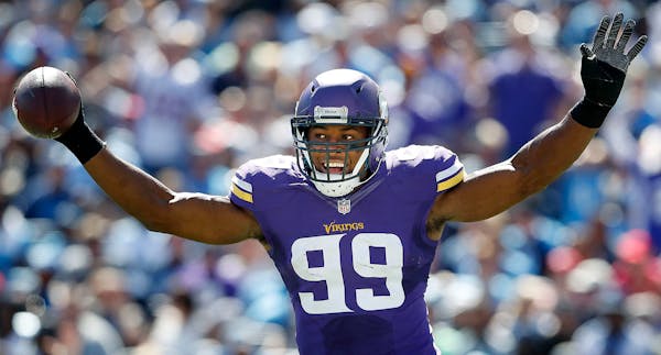 Danielle Hunter (99) celebrated after returning a fumble 24-yards for a touchdown in the fourth quarter.