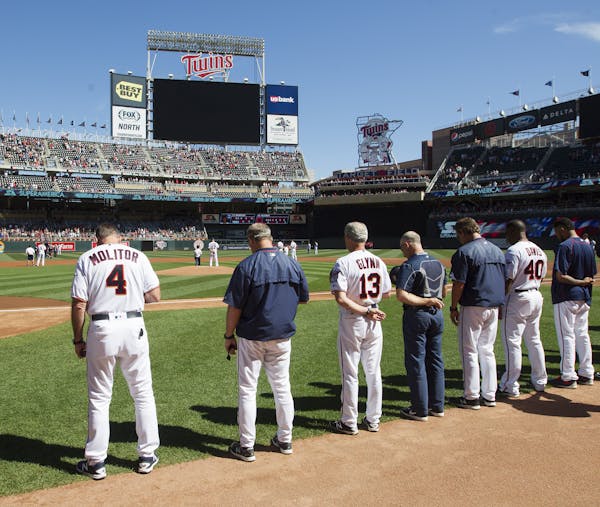 The Twins, including manager Paul Molitor,stood for a moment of silence in honor of September 11th before Sunday's game against Cleveland at Target Fi