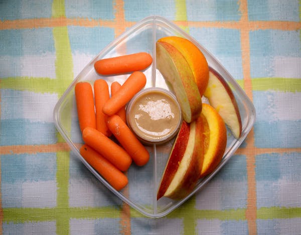 Salted Tahini Spread is an easy dip with carrots and apple slices. Oranges will keep the apples from turning brown too fast. (Diedra Laird/Charlotte O