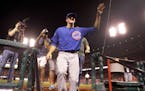 Chicago Cubs starting pitcher Kyle Hendricks waves as he leaves the field following a baseball game against the St. Louis Cardinals, Monday, Sept. 12,
