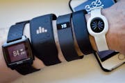 Fitness trackers, from left, Basis Peak, Adidas Fit Smart, Fitbit Charge, Sony SmartBand, and Jawbone Move. (AP Photo/Bebeto Matthews, File)