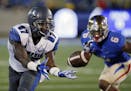 Memphis wide receiver Tevin Jones (87) reaches for a pass in front of Tulsa cornerback Darrell Williams (6) in the first quarter of an NCAA college fo