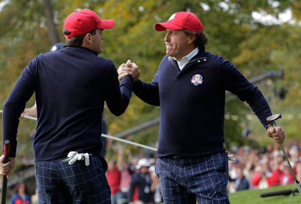 USA's Keegan Bradley congratulates Phil Mickelson during the 2012 Ryder Cup.