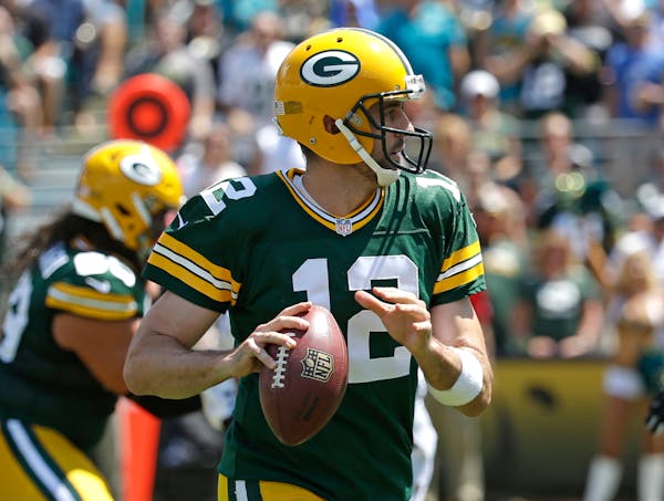 Green Bay Packers quarterback Aaron Rodgers looked for a receiver during the first half against the Jacksonville Jaguars on Sunday.