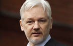 FILE - In this Feb. 5, 2016, file photo, WikiLeaks founder Julian Assange stands on the balcony of the Ecuadorean Embassy in London. WikiLeaks� glob