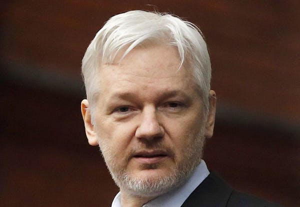 FILE - In this Feb. 5, 2016, file photo, WikiLeaks founder Julian Assange stands on the balcony of the Ecuadorean Embassy in London. WikiLeaks� glob