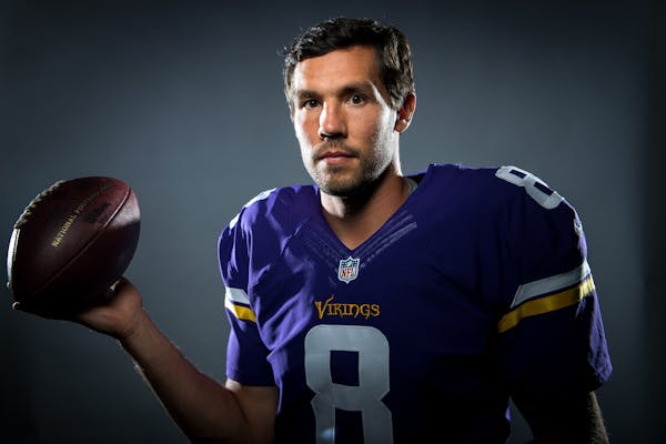 Sam Bradford, playing for his third team in his seventh NFL season, posed in his Vikings uniform on Friday. The Vikings open their 56th season on Sund