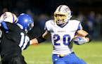 STMA�s Mitchell Kartes, #20, runs up the middle for yardage against Rogers