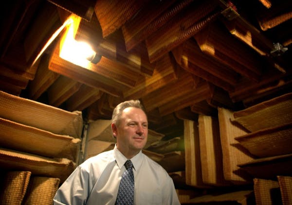 Starkey's then-president, Jerry Ruzicka, in the company's soundproof room where hearing aids are tested on March 2006.