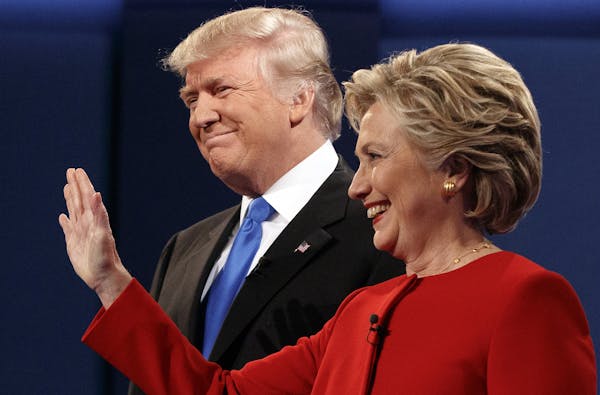 Republican presidential candidate Donald Trump, left, stands with Democratic presidential candidate Hillary Clinton at the first presidential debate a