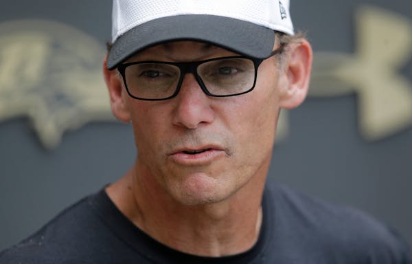 FILE - In this June 18, 2015, file photo, Baltimore Ravens offensive coordinator Marc Trestman speaks at a news conference after NFL football minicamp