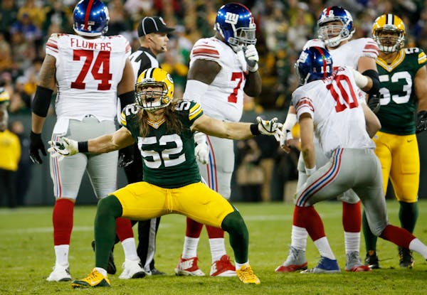 Green Bay Packers' Clay Matthews celebrates a sack of New York Giants quarterback Eli Manning during the second half of an NFL football game Sunday, O
