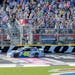 Jimmie Johnson (48) crosses the finish line to win a NASCAR Sprint Cup Series auto race, Sunday, Oct. 9, 2016, at Charlotte Motor Speedway in Concord,