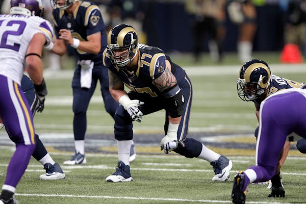 St. Louis Rams offensive tackle Jake Long takes his position against the Vikings in 2014. On Tuesday, Minnesota signed Long.