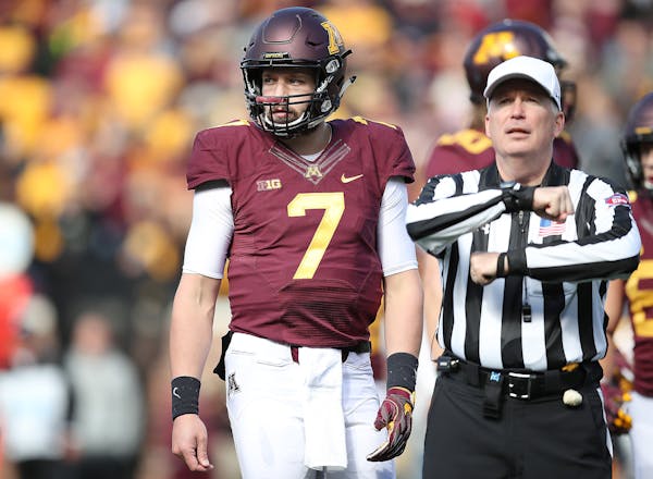 Quarterback Mitch Leidner looked to the bench after the Gophers were called for one of their three false-start penalties in the fourth quarter on Satu