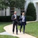 President Obama walks with personal aide Joe Paulsen, a Minnesota native who has been with Obama since the 2007 presidential campaign in Iowa.