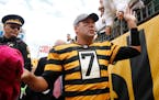 Pittsburgh Steelers quarterback Ben Roethlisberger (7) greets fans while leaving the field following their 31-13 win against the New York Jets in Pitt