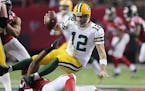 Atlanta Falcons defensive end Adrian Clayborn sacks Green Bay Packers quarterback Aaron Rodgers during the third quarter in an NFL football game on Su