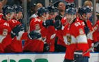 Florida Panthers right wing Jaromir Jagr (68) is congratulated after scoring a goal against the Washington Capitals during the second period of an NHL