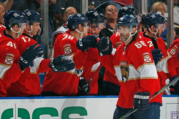 Florida Panthers right wing Jaromir Jagr (68) is congratulated after scoring a goal against the Washington Capitals during the second period of an NHL