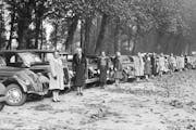 Women volunteers from all walks of life, many of them owners of cars which they have placed at the disposal of A.R.P. service in Paris, undergo regula