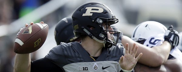 Purdue quarterback David Blough (11) throws against Penn State during the first half of an NCAA college football game in West Lafayette, Ind., Saturda