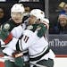 Wild center Mikko Koivu (left) and left winger Zach Parise celebrated Parise's first of two goals -- and the 300th of his NHL career -- against the Ne