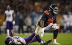 Chicago Bears defensive end Cornelius Washington (90) dropped Vikings quarterback Sam Bradford (8) to the turf after he got rid of the ball in the thi