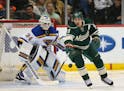 Wild left wing Zach Parise (11) reached for loose puck in front of Blues goalie Jake Allen (34) in the first period Sunday night. ] JEFF WHEELER � j