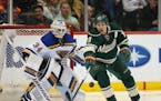Wild left wing Zach Parise (11) reached for loose puck in front of Blues goalie Jake Allen (34) in the first period Sunday night. ] JEFF WHEELER � j