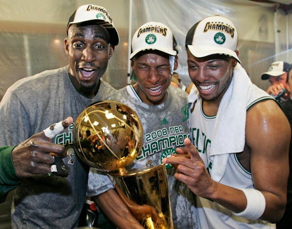 Boston Celtics' Kevin Garnett, left, Ray Allen, center, and Paul Pierce celebrate after winning the NBA championship in 2008