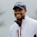 United States vice-captain Tiger Woods smiles during a practice round for the Ryder Cup golf tournament Wednesday, Sept. 28, 2016, at Hazeltine Nation