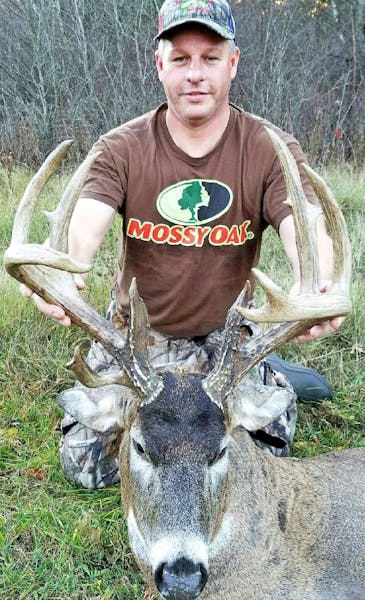 Craig Yehlik of New Richmond with the buck he arrowed on the northwest portion of St. Croix County, Wis.