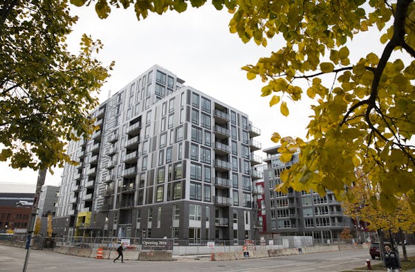 The Encore apartments, under construction in the Minneapolis Mill District, will add to the rental market in the Twin Cities, which is red-hot right n
