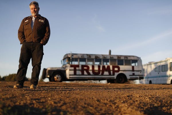 Ed Rush stood in front of a bus at his home that he and his son painted to show their support for Donald Trump in Pierz, Minn.