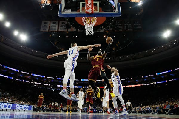Late surge propels Cavs past Sixers