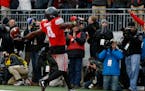 Ohio State running back Curtis Samuel celebrates his touchdown against Michigan during the second overtime of an NCAA college football game Saturday, 