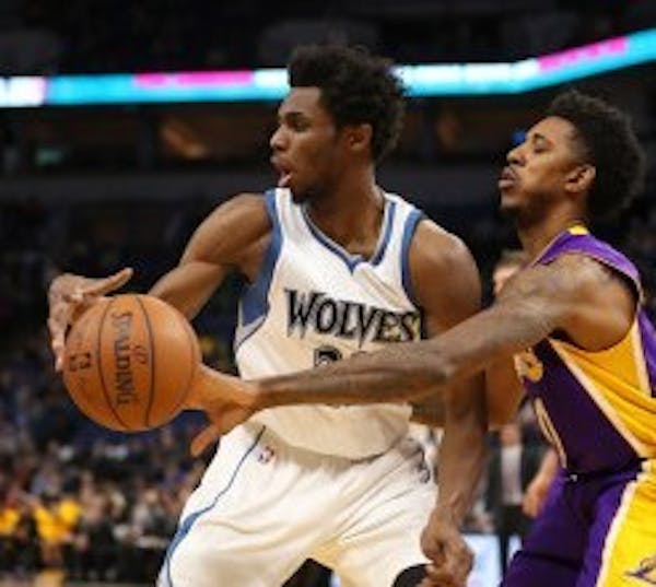 Los Angeles Lakers guard Nick Young (0) slapped the ball from Timberwolves forward Andrew Wiggins (22) in the first quarter but Wiggins got the last l